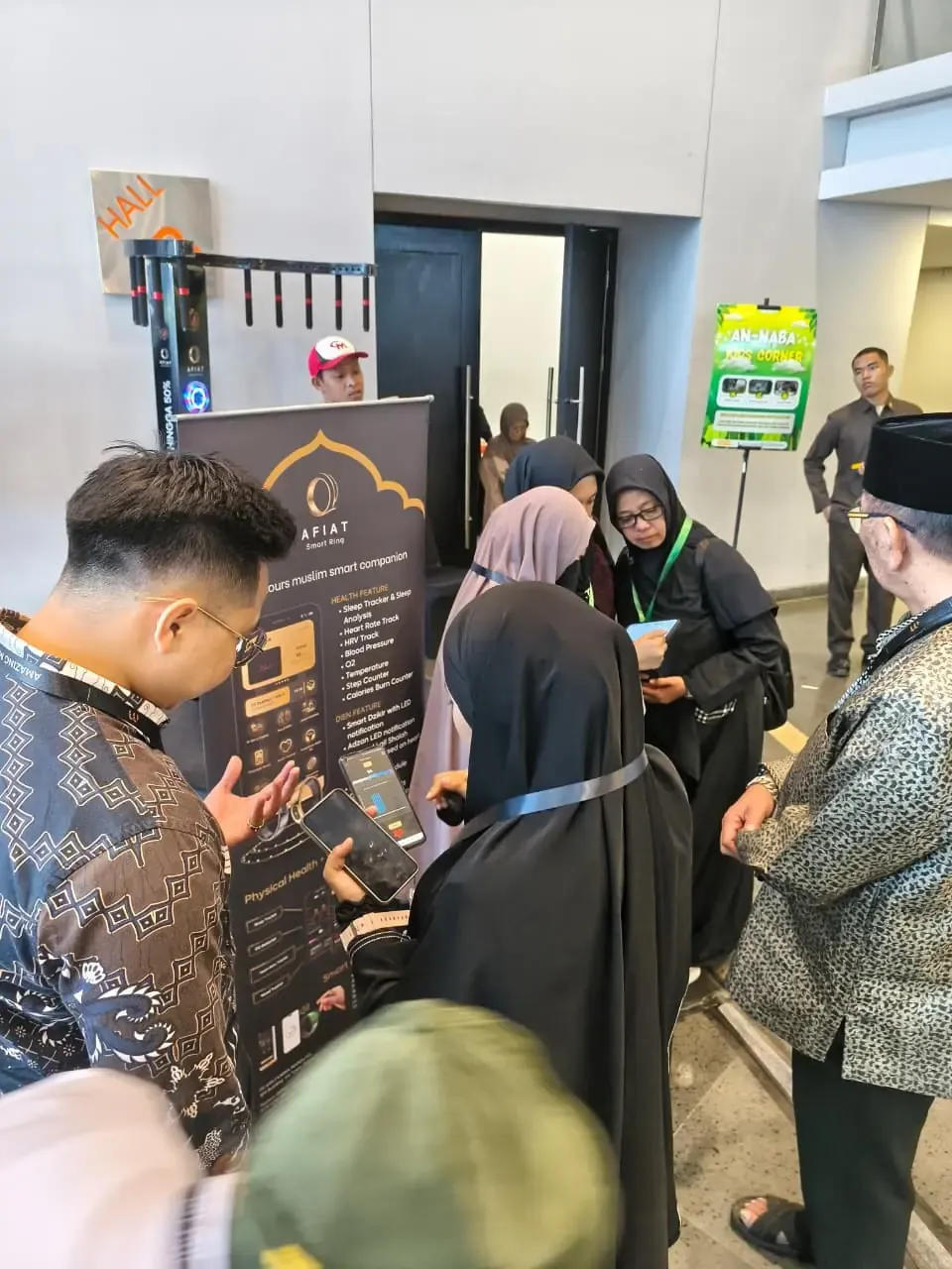 Visitors trying the AFIAT Smart Ring at an exhibition booth